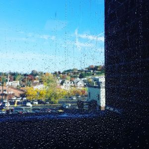 Photo by Colleen S. Good. Water droplets on a Morgantown, W.Va. office building window. The source--window washers.